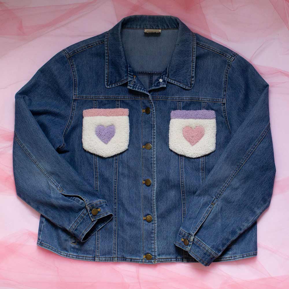 Upcycled jean jacket with rugs on the pockets