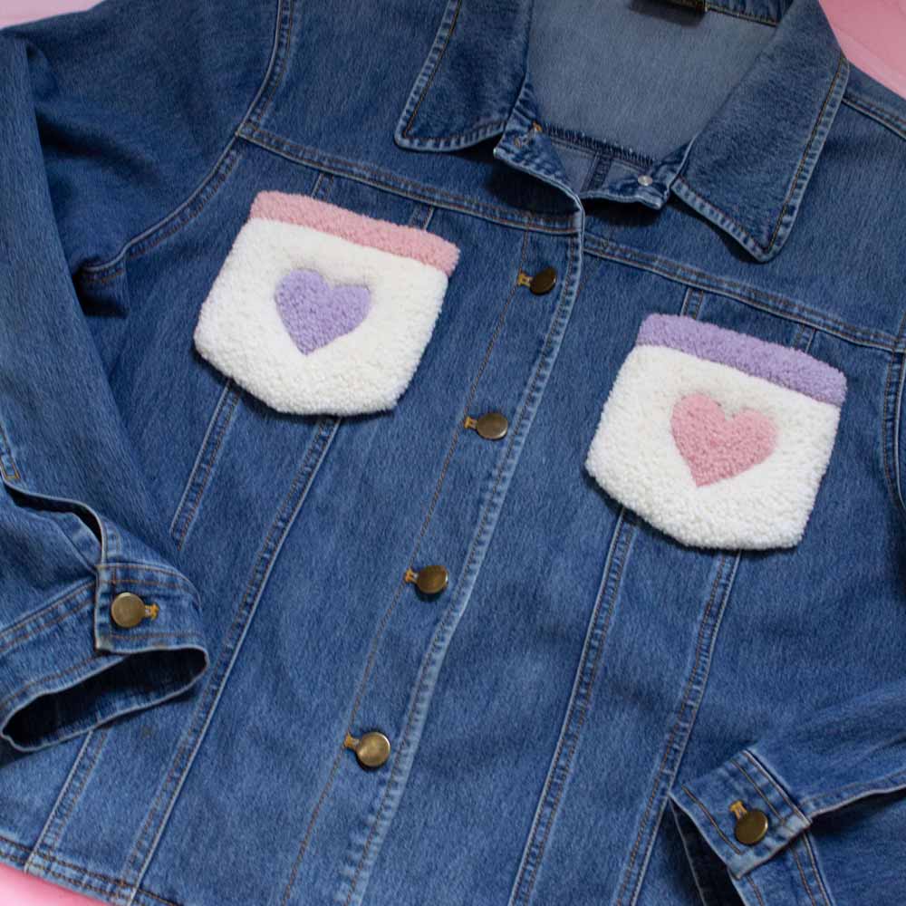 Upcycled jean jacket with rugs on the pockets