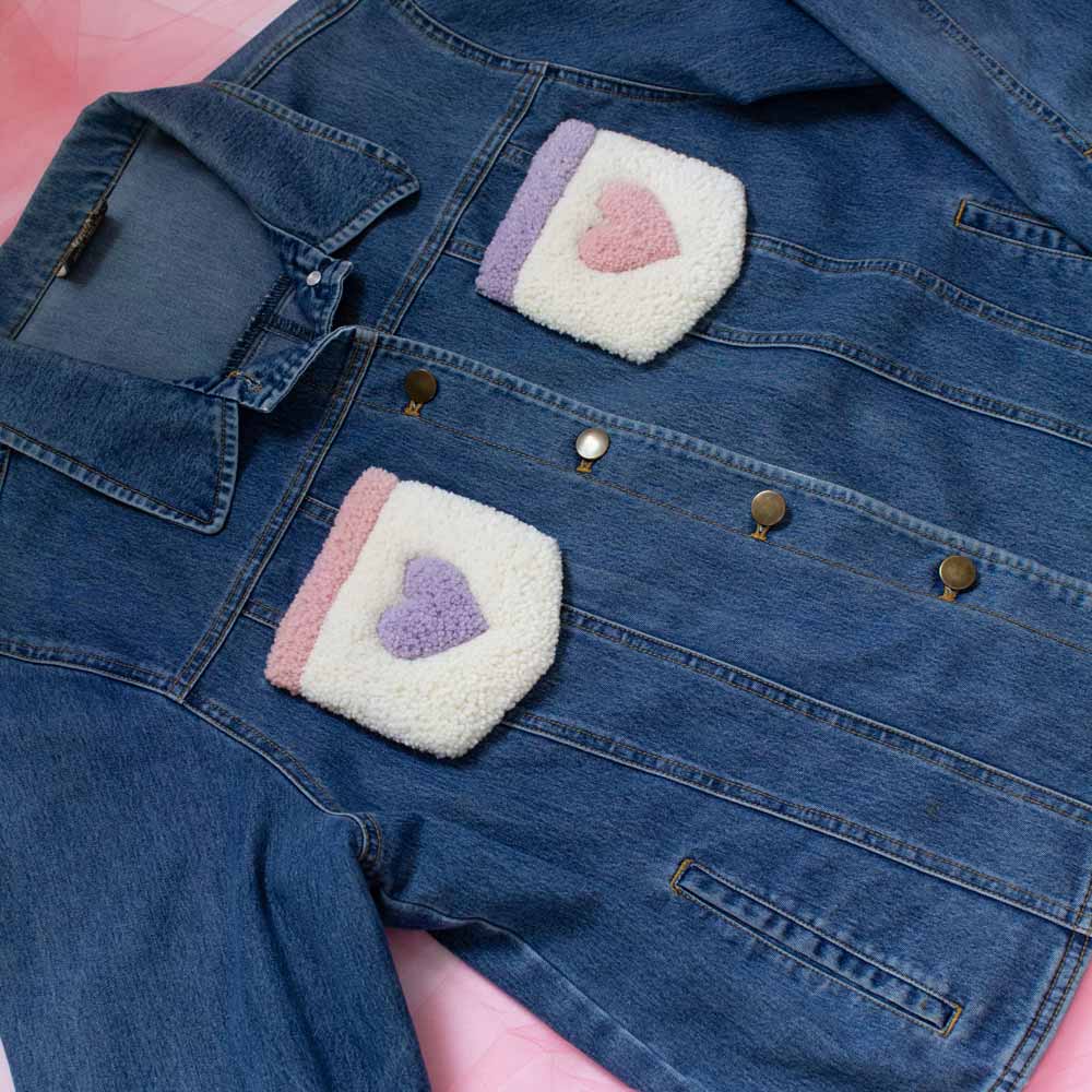 Upcycled jean jacket with rugs on the pockets