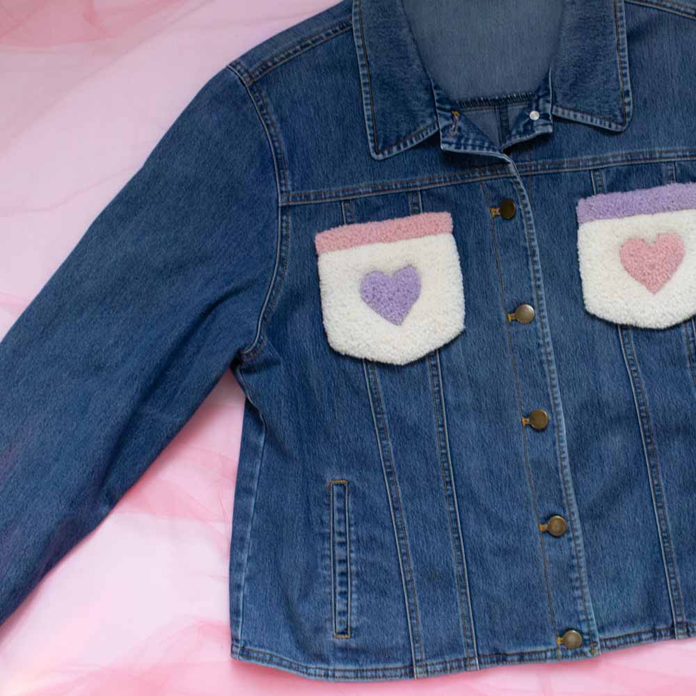 Upcycled jean jacket with rugs on the pockets