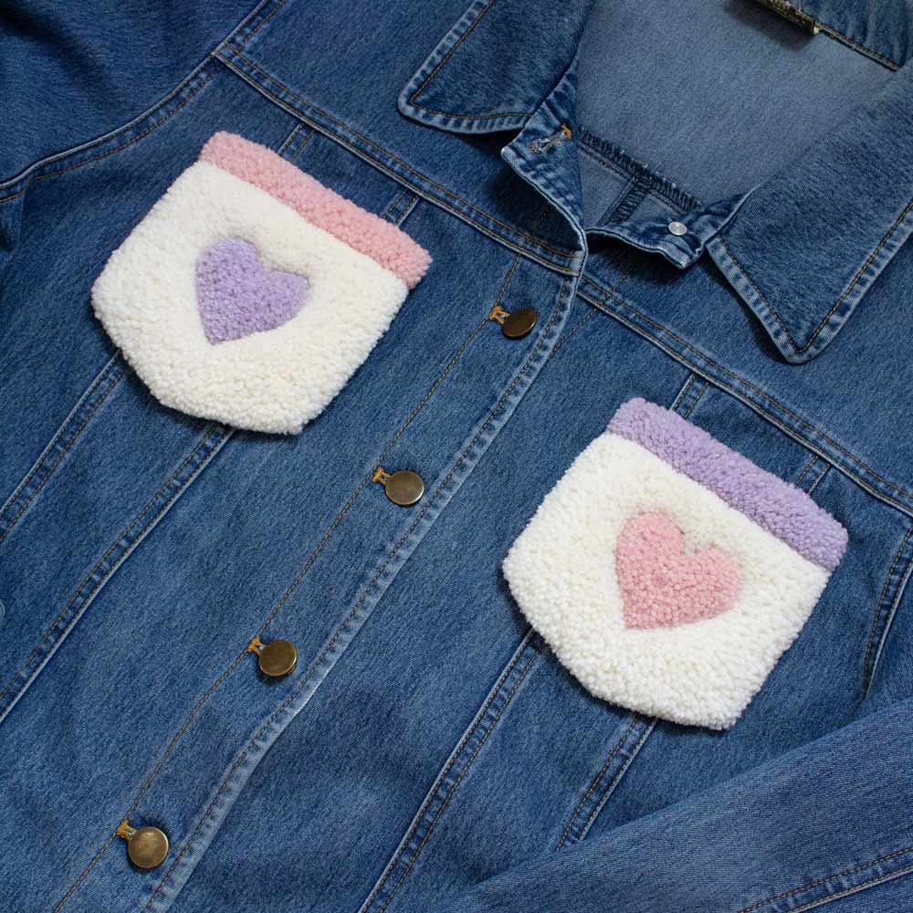 Upcycled jean jacket with rugs on the pockets