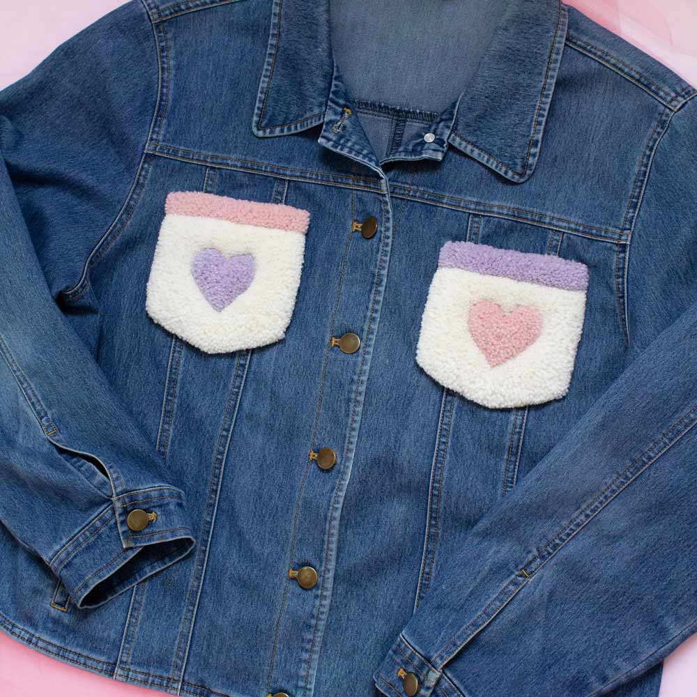 Upcycled jean jacket with rugs on the pockets