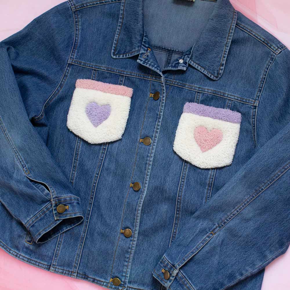 Upcycled jean jacket with rugs on the pockets